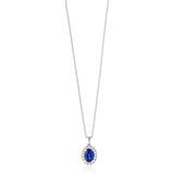 18ct White Gold Four Claw Set Oval Cut Sapphire and Round Brilliant Cut Diamond Halo Cluster Pendant and Chain
