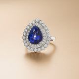 Platinum Three Claw Set Pear Shaped Sapphire and Round Brilliant Cut Diamond Double Halo Cluster Ring