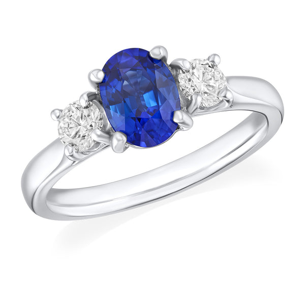 Platinum Four Claw Set Oval Cut Sapphire and Round Brilliant Cut Diamond Ring