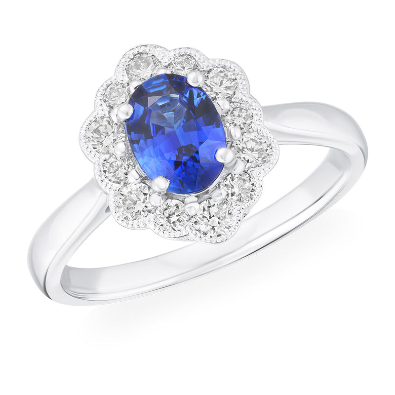 Platinum Four Claw Set Oval Cut Sapphire and Round Brilliant Cut Diamond Halo Cluster Ring