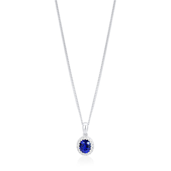 18ct White Gold Grain Set Oval Cut Sapphire and Round Brilliant Cut Diamond Halo Cluster Pendant and Chain