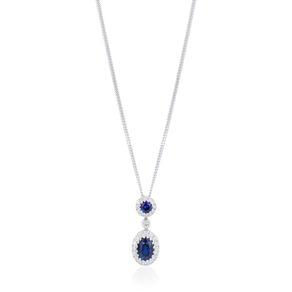 18ct White Gold Grain Set Oval Cut Sapphire and Round Brilliant Cut Diamond Halo Cluster Drop Pendant and Chain