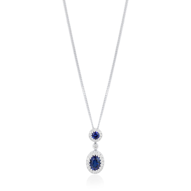 18ct White Gold Grain Set Oval Cut Sapphire and Round Brilliant Cut Diamond Halo Cluster Drop Pendant and Chain
