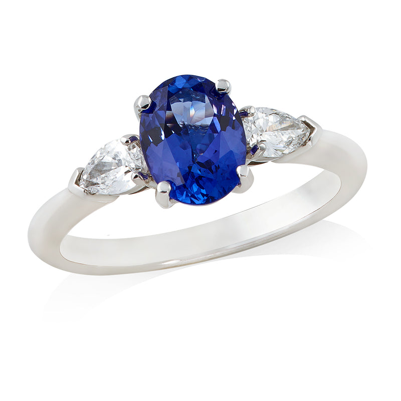 18ct White Gold Three Stone Four Claw Set Oval Cut Tanzanite and Pear Cut Diamond Ring