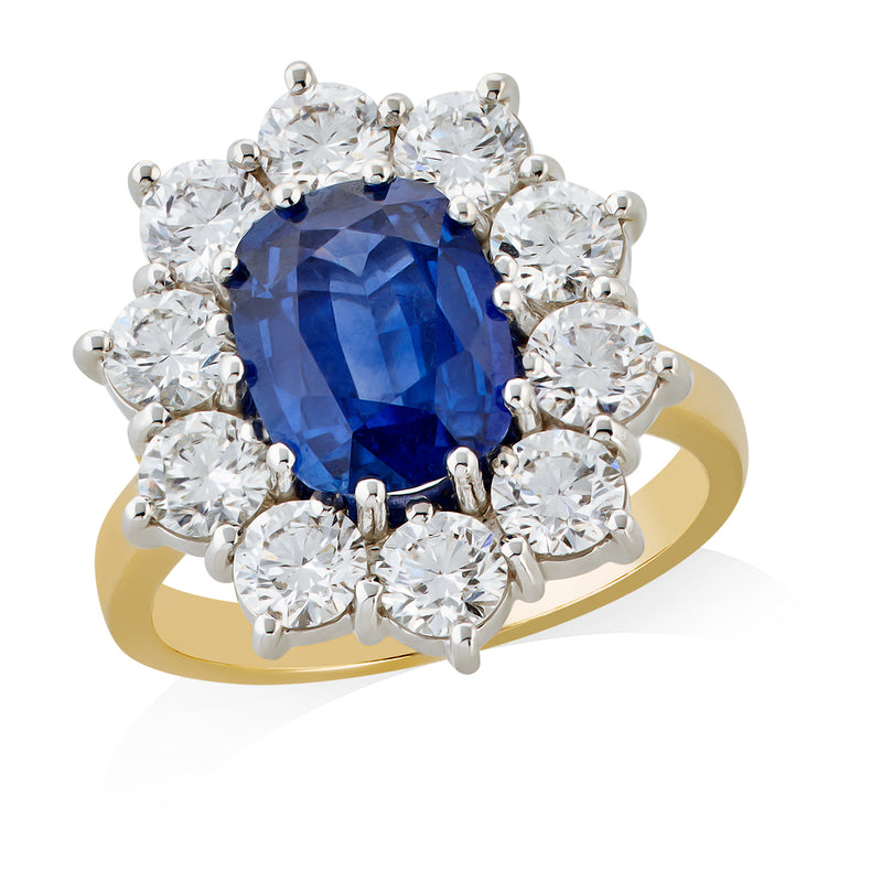 18ct Yellow and White Gold Ten Claw Set Oval Cut Sapphire and Round Brilliant Cut and Diamond Ring