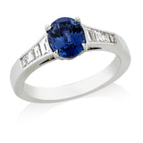 Platinum Solitaire Four Claw Set Oval Cut Sapphire Ring with Diamond Channel Set Shoulders