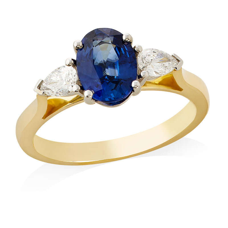 18ct Yellow and White Gold Three Stone Four Claw Set Oval Cut Sapphire and Pear Cut Diamond Ring
