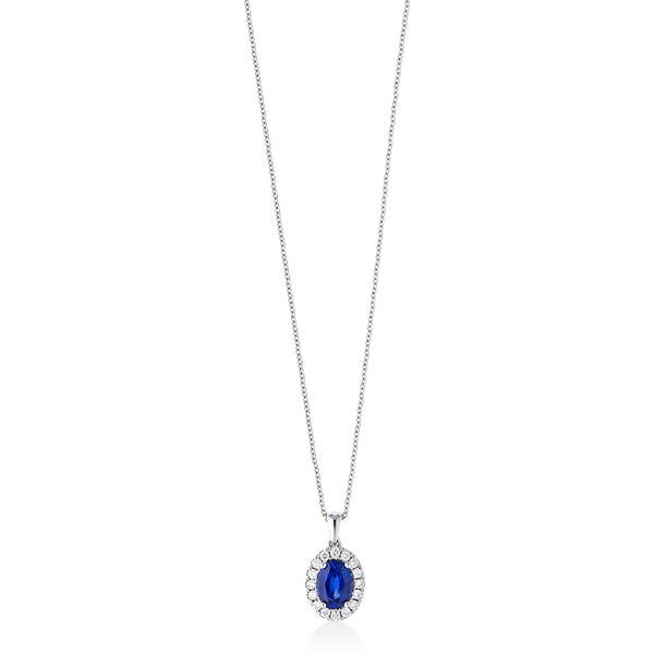 18ct White Gold Four Claw Set Oval Cut Sapphire and Round Brilliant Cut Diamond Halo Cluster Pendant and Chain