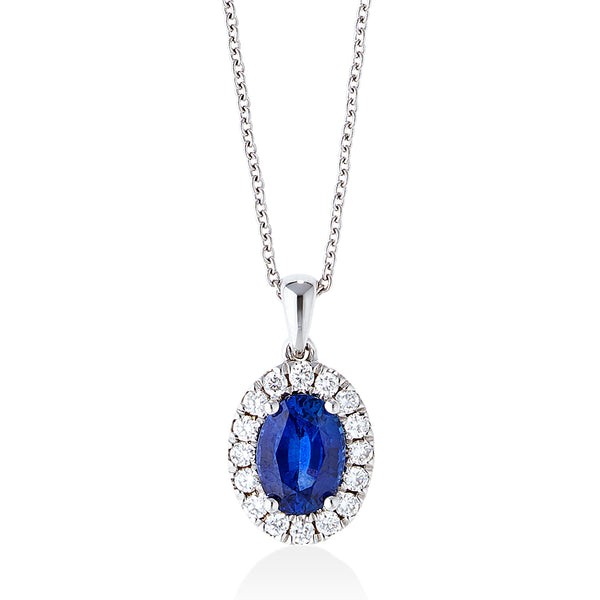18ct White Gold Four Claw Set Oval Cut Sapphire and Round Brilliant Cut Diamond Halo Cluster Pendant and Chain