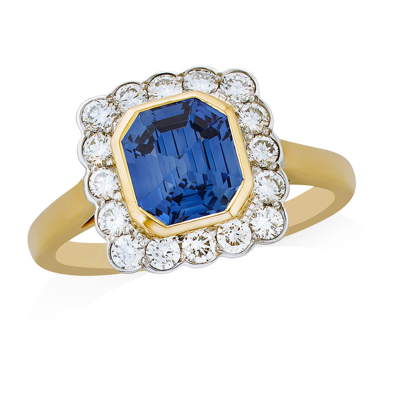 Platinum and 18ct Yellow Gold Rub Set Emerald Cut Sapphire and Round Brilliant Cut Halo Cluster Ring