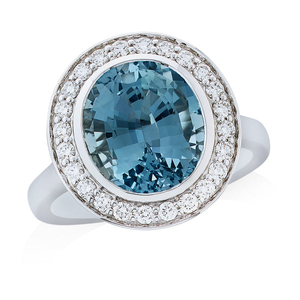 18ct White Gold Rub Set Oval Cut Aquamarine and Round Brilliant Cut Diamond Halo Cluster Ring
