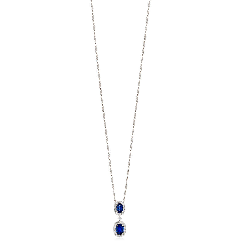 18ct White Gold Four Claw Set Oval Cut Sapphire and Round Brilliant Cut Diamond Halo Cluster Pendant and Chain