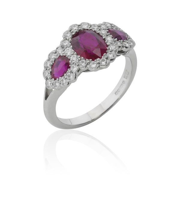 Platinum Three Stone Oval Cut Ruby and Pear Cut Ruby Ring with Split Shoulders